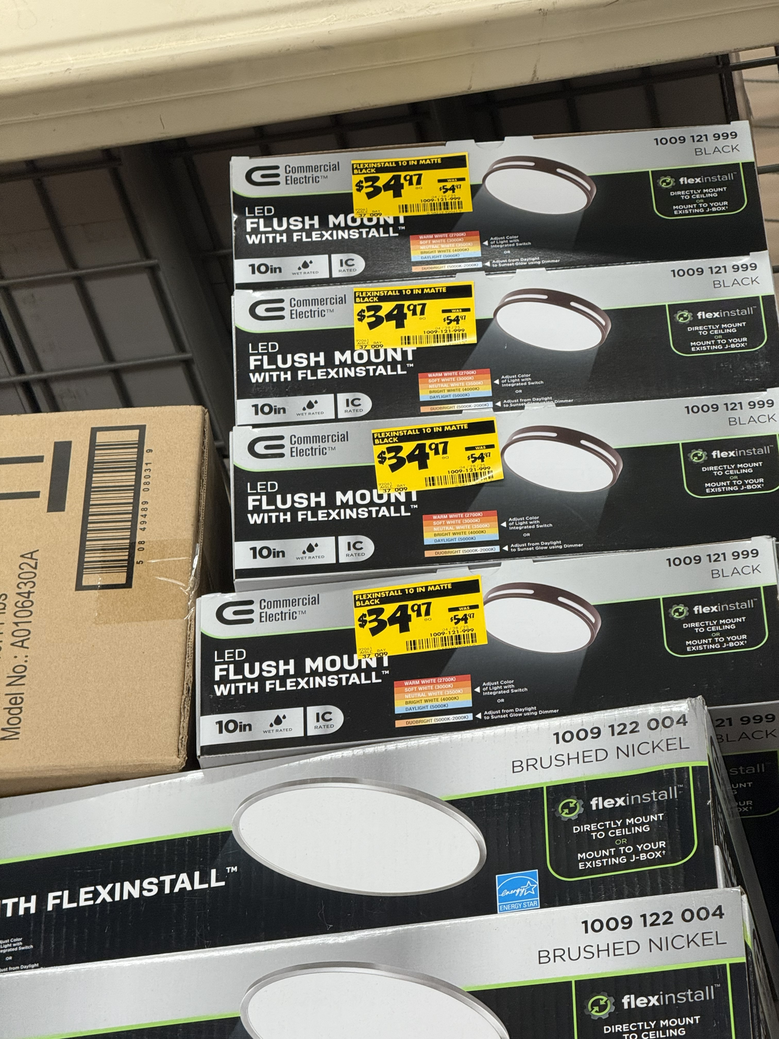 Close-up of overhead clearance items with visible yellow price tags